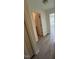 Hallway leading to bathroom and bedroom with new floors at 8013 River Water Ct, Raleigh, NC 27616