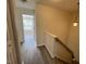 Hallway with new floors leading to bedroom at 8013 River Water Ct, Raleigh, NC 27616