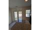 Kitchen island with granite counters and a view through sliding glass doors to the patio at 8013 River Water Ct, Raleigh, NC 27616