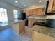 Stylish kitchen with granite countertops, island, and stainless steel appliances at 8013 River Water Ct, Raleigh, NC 27616