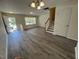 Inviting living area showcasing modern flooring and lots of natural light at 8013 River Water Ct, Raleigh, NC 27616