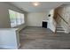 Bright living room with large windows, fireplace, and modern flooring at 8013 River Water Ct, Raleigh, NC 27616