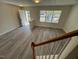 Spacious and open living room with hardwood floors, filled with lots of natural light at 8013 River Water Ct, Raleigh, NC 27616