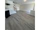 Open concept living room with natural lighting and hard wood floors at 8013 River Water Ct, Raleigh, NC 27616