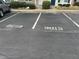 Asphalt parking lot with available parking spaces at 8013 River Water Ct, Raleigh, NC 27616