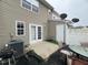 Back patio area with a privacy fence and outdoor seating at 8013 River Water Ct, Raleigh, NC 27616