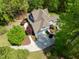 Aerial view of craftsman-style home with well-manicured landscaping and circular driveway at 8480 Falkirk Ridge Ct, Wake Forest, NC 27587