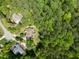 Aerial view of homes nestled among the trees in a wooded community at 8480 Falkirk Ridge Ct, Wake Forest, NC 27587