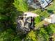 Aerial view of the home and landscaped property in wooded community at 8480 Falkirk Ridge Ct, Wake Forest, NC 27587