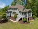 Inviting two-story home with a screened in porch, landscaped yard, and attached garage at 8480 Falkirk Ridge Ct, Wake Forest, NC 27587