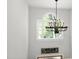 Bright foyer with high ceiling and large window with chandelier hanging, offering natural light at 8480 Falkirk Ridge Ct, Wake Forest, NC 27587