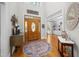 Inviting foyer with hardwood floors, high ceilings, and a decorative front door that enhances its charm at 8480 Falkirk Ridge Ct, Wake Forest, NC 27587