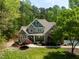Beautiful house with lush landscaping, a manicured lawn, and a long paved driveway at 8480 Falkirk Ridge Ct, Wake Forest, NC 27587
