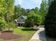 Attractive two-story house with stone accents, landscaping, and a paved driveway at 8480 Falkirk Ridge Ct, Wake Forest, NC 27587