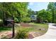 Charming two-story home with a well-manicured lawn, mature trees, and long driveway at 8480 Falkirk Ridge Ct, Wake Forest, NC 27587