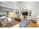 Bright living room with an entertainment center, hardwood floors, and an open floor plan at 8480 Falkirk Ridge Ct, Wake Forest, NC 27587