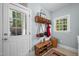 Functional mud room with ample storage space, hooks, baskets, and natural light at 8480 Falkirk Ridge Ct, Wake Forest, NC 27587