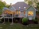 Back of home featuring a large screened porch, deck, and view of the backyard at 8480 Falkirk Ridge Ct, Wake Forest, NC 27587