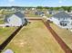 An aerial view displays the property's fenced yard and its proximity to other homes in the neighborhood at 85 Sun Mdw Cir, Benson, NC 27504