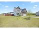 Charming home features a well-manicured lawn, an attached garage, and a cozy front porch at 85 Sun Mdw Cir, Benson, NC 27504