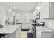 Bright kitchen featuring modern appliances, granite counters, and ample cabinet space at 85 Sun Mdw Cir, Benson, NC 27504