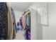 Walk-in closet featuring ample storage space with hanging rods, shelves, and an electrical panel on the wall at 85 Sun Mdw Cir, Benson, NC 27504