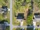 Aerial view of a house with mature trees and a large yard, showcasing the property layout at 8812 Green Arbor Ct, Wake Forest, NC 27587
