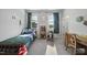 Cozy bedroom features a writing desk, a cozy chair, and cheerful decor, creating a warm and inviting space at 8812 Green Arbor Ct, Wake Forest, NC 27587