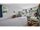 Spacious bedroom featuring bunk beds, two windows and two comfy beanbag chairs at 8812 Green Arbor Ct, Wake Forest, NC 27587