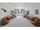 Spacious bedroom featuring two bunk beds with desks, two windows and two comfy beanbag chairs at 8812 Green Arbor Ct, Wake Forest, NC 27587