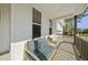 Cozy front porch seating area featuring comfortable pillows, accent chairs, and a charming view at 8812 Green Arbor Ct, Wake Forest, NC 27587