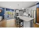 Bright kitchen with island, pendant lighting, stainless appliances, and convenient access to outdoor deck at 8812 Green Arbor Ct, Wake Forest, NC 27587