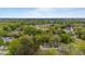 This aerial shot shows a neighborhood with mature trees at 905 David St, Henderson, NC 27536