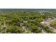 Areal view of cozy community surrounded by mature trees and neighborhood stores at 905 David St, Henderson, NC 27536