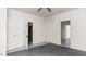 A bedroom with carpet, a ceiling fan, and bright lighting at 905 David St, Henderson, NC 27536