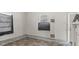 A bedroom with tile floors, white trim, and bright lighting at 905 David St, Henderson, NC 27536