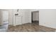 A spacious living room with tile floors, white trim, and bright lighting at 905 David St, Henderson, NC 27536