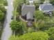 Aerial view of home with screened porch, patio with fire pit, lush yard, and playground at 9100 Dansforeshire Way, Wake Forest, NC 27587