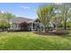 Beautiful backyard featuring a screened-in porch and relaxing outdoor seating area at 9100 Dansforeshire Way, Wake Forest, NC 27587