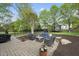 Charming backyard patio with comfortable seating, perfect for relaxation and enjoying the well-manicured outdoor space at 9100 Dansforeshire Way, Wake Forest, NC 27587