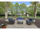 Cozy backyard patio with outdoor seating, manicured mulch beds, and a well-maintained backyard at 9100 Dansforeshire Way, Wake Forest, NC 27587