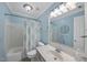Clean bathroom featuring a shower/tub combo, and a single sink vanity with a large mirror at 9100 Dansforeshire Way, Wake Forest, NC 27587