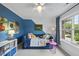 Cozy bedroom featuring a daybed, playful decor, and plenty of natural light at 9100 Dansforeshire Way, Wake Forest, NC 27587