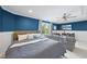 Large bedroom featuring a bed, sofa, TV, and plenty of space for relaxation and entertainment at 9100 Dansforeshire Way, Wake Forest, NC 27587