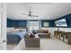 Bright, combined living and sleeping area featuring ample seating, a bed, and entertainment options at 9100 Dansforeshire Way, Wake Forest, NC 27587
