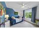 Bright bedroom with a daybed, colorful accents, and a comfortable, stylish design at 9100 Dansforeshire Way, Wake Forest, NC 27587