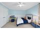 Comfortable bedroom with a blue-themed decor, wainscoting, and a cozy, inviting feel at 9100 Dansforeshire Way, Wake Forest, NC 27587
