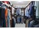 Walk-in closet offering ample storage with custom shelving and hanging racks at 9100 Dansforeshire Way, Wake Forest, NC 27587