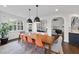 Large dining table and direct view into the grand living room at 9100 Dansforeshire Way, Wake Forest, NC 27587