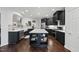 Spacious kitchen featuring dark cabinets, a center island, and stainless-steel appliances at 9100 Dansforeshire Way, Wake Forest, NC 27587